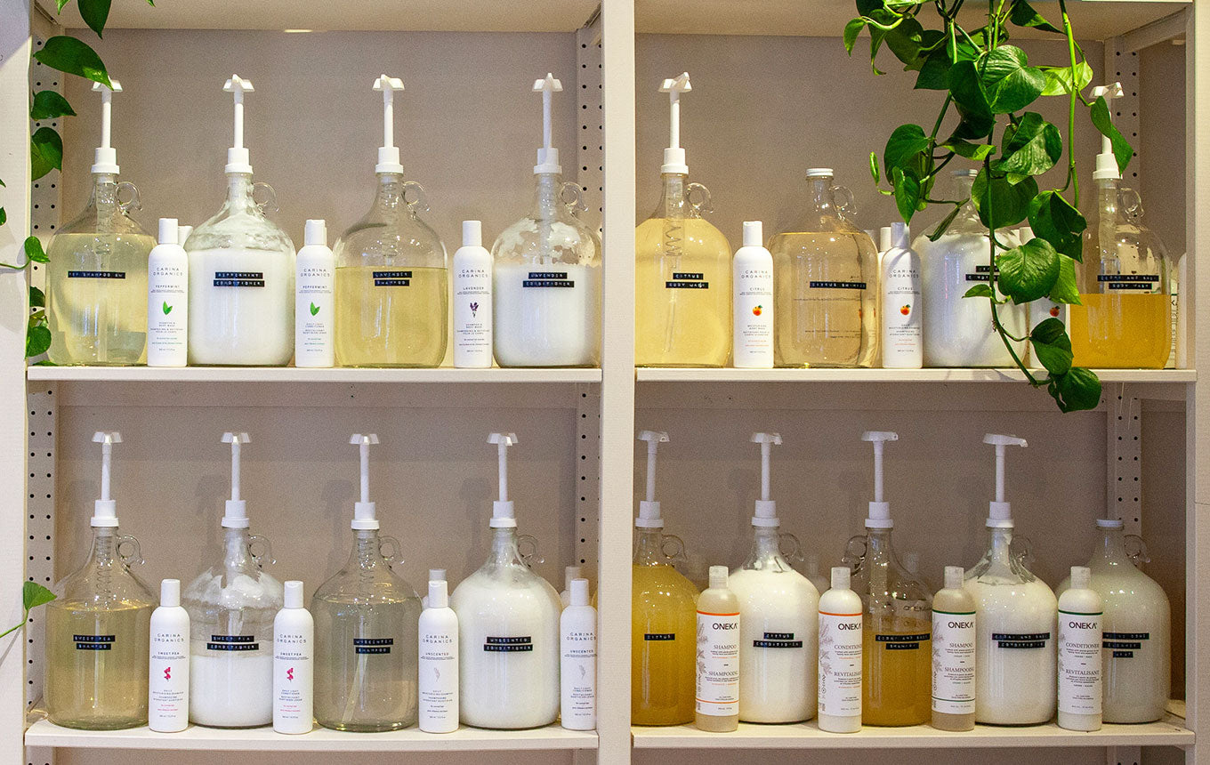 Row of refillable soap containers on Canary's refillery way